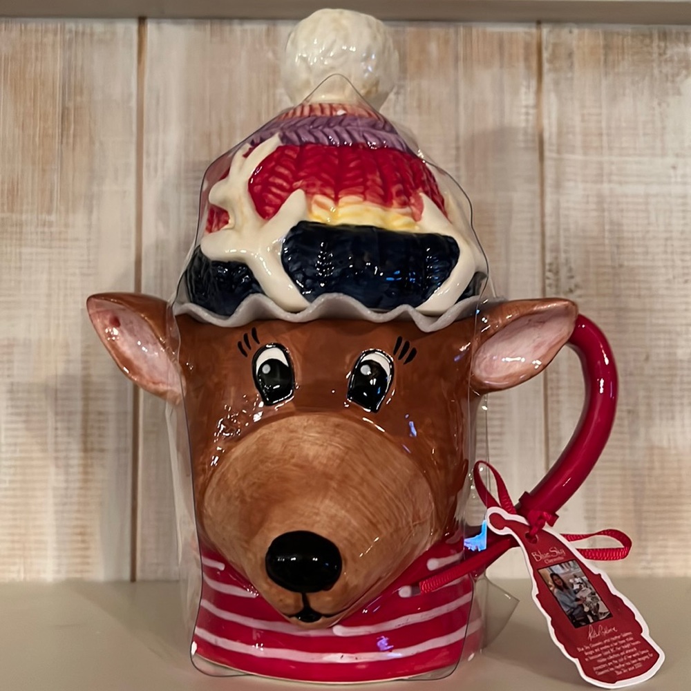 NWT blue sky, handcrafted, reindeer mug. It has the lid on it,